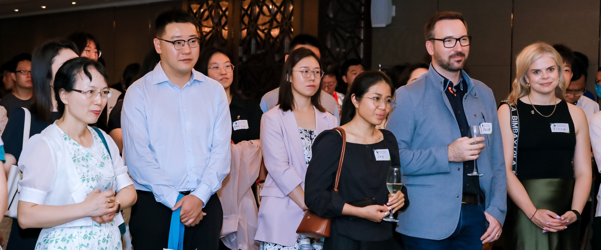 UCD alumni listening to a speaker at a global event in Beijing.